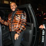 Tyler Perry Promotes Six Triple Eight in a House of Gray Custom Pony Hair Jacket