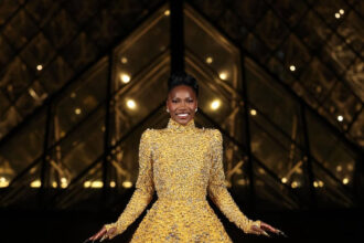 Doechii Wore a Gold Valentino SS25 Couture Gown to the Le Grand Diner du Louvre Gala