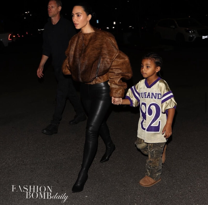 Kim Kardashian Stepped Out with her Son Psalm West in a Brown Fur Bomber Jacket with Black Leather Leggings