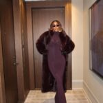 Kelly Rowland Wore a Burgundy ‘Sons of Gemini’ Dress and a $1,490 Retrofete Faux Fur Coat to Broadway