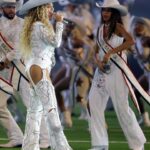 Beyonce Wears Custom Roberto Cavalli Couture White Feather Look and an ASN Cowboy Hat while Blue Ivy Wears Custom Frolov Heart and a Stetson Hat to Perform for NFL Halftime on Christmas Day!