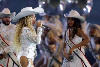 Beyonce Wears Custom Roberto Cavalli Couture White Feather Look and an ASN Cowboy Hat while Blue Ivy Wears Custom Frolov Heart and a Stetson Hat to Perform for NFL Halftime on Christmas Day!