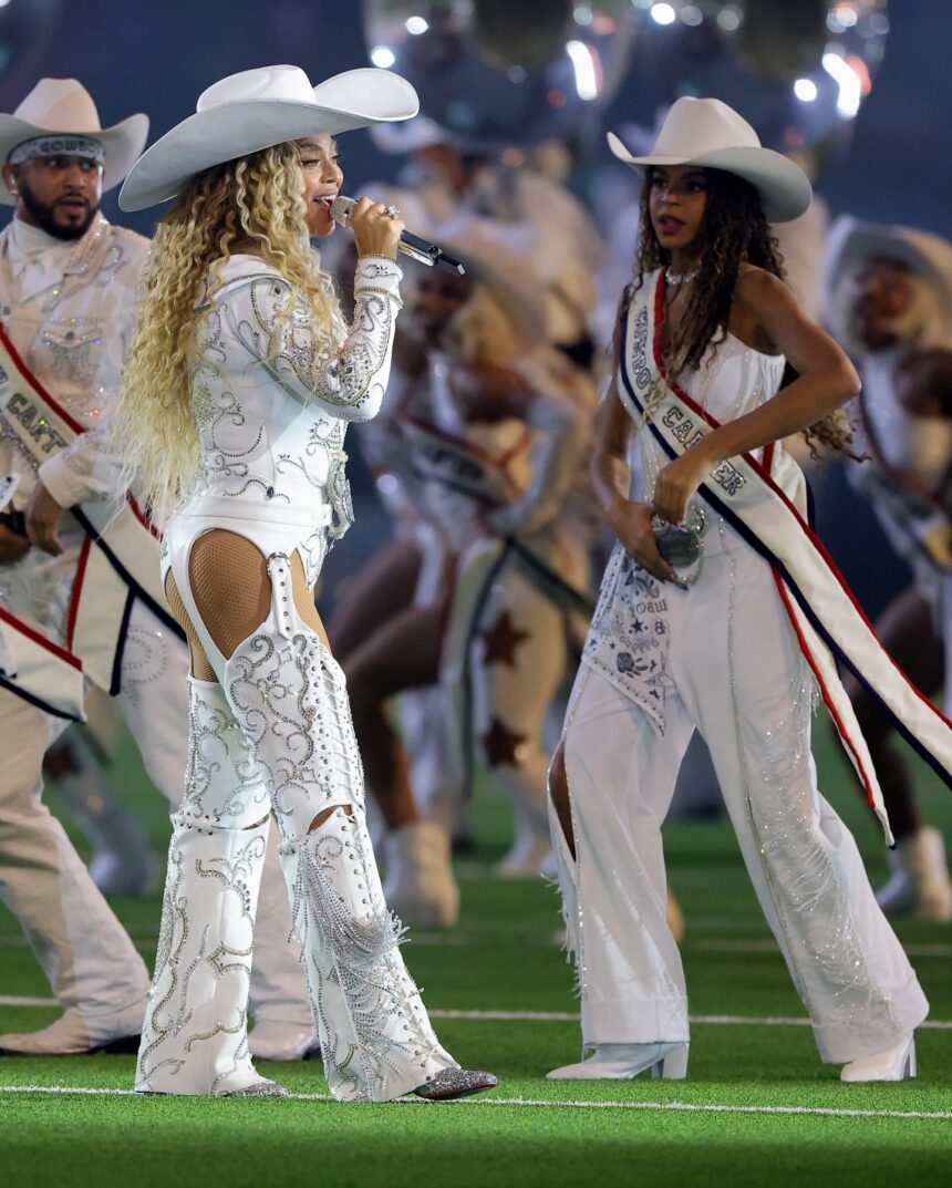 Beyonce Wears Custom Roberto Cavalli Couture White Feather Look and an ASN Cowboy Hat while Blue Ivy Wears Custom Frolov Heart and a Stetson Hat to Perform for NFL Halftime on Christmas Day!