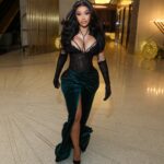 Cardi B Celebrates the New Year in Miami Wearing a Mimoza Kadriaj Black Velvet Drape Gown and a Custom Jordon Wllis Pink and Green Lace Mini Dress