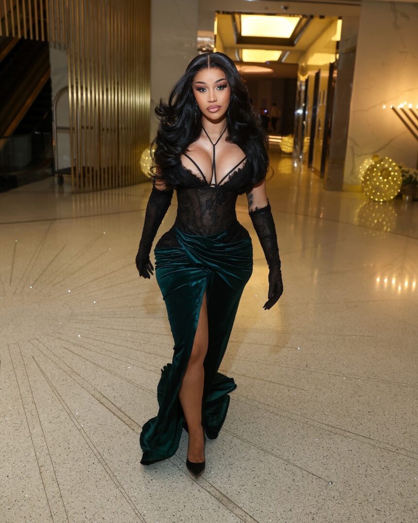 Cardi B Celebrates the New Year in Miami Wearing a Mimoza Kadriaj Black Velvet Drape Gown and a Custom Jordon Wllis Pink and Green Lace Mini Dress