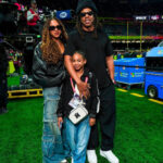 Jay-Z Attended the Superbowl in an All-Black Look with Blue Ivy in a Black Balenciaga Leather Jacket and Rumi Rocking an Off-White Amiri Crossbody