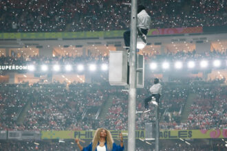 Serena Williams Crip Walks on Stage at the Super Bowl LIX in a Cobalt Blue Nike Crop Jacket and Mini Tennis Skirt