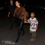 Kim Kardashian Stepped Out with her Son Psalm West in a Brown Fur Bomber Jacket with Black Leather Leggings